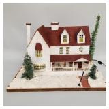 Large vintage light-up stucco house display on