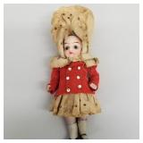 Miniature antique jointed bisque doll with glass