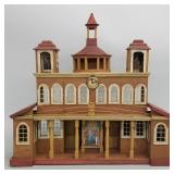 Antique folk art painted building with clock tower