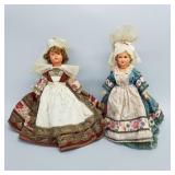 2 vintage celluloid dolls with elaborate folk