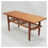 Teak mid-century coffee table with woven lower