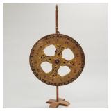 Vintage painted gaming wheel on wooden stand