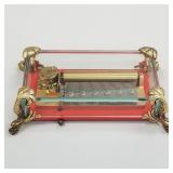 Reuge glass music box with dolphin feet- label