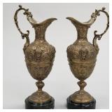 Pair matching bronze ewers with faces on marble