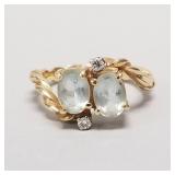 14K gold ring set with light blue stones &