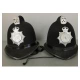 2 Dorset police helmets w/ insignia- 9"H