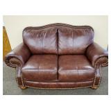 Leather upholstered loveseat-
