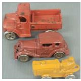 3 small vintage cast iron vehicles incl an Austin