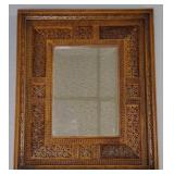 Carved openwork framed beveled mirror 18"x 15"