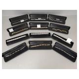 12 N.O.S. stainless steel bracelets w/ boxes incl.
