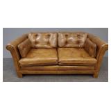 Leather upholstered love seat- 66'W 28'H 37'D