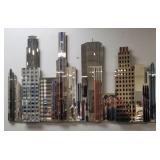 Lg mirrored cityscape wall sculpture -