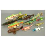 12 fish spearing decoys/ lures incl some signed,