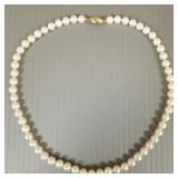 16" strand of  6 to 6.5mm pearls w/ 14k gold clasp