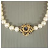 32"L strand of 7mm pearls w/ 14K gold clasp s/w
