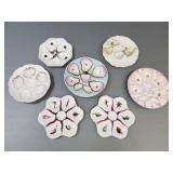 7 antique decorated oyster plates- 9 1/2' largest