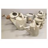 6 galvanized watering cans some w/ roses