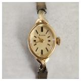 Bulova ladies watch in 14k gold case w/