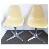 Pair of Burke of Texas propeller base chairs
