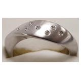 Free form sterling ring set with diamonds