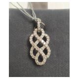 Sterling silver pendant set with several diamonds