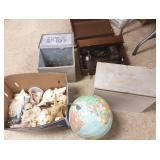 Group including globe, sewing machine, shells,
