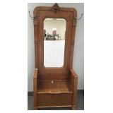 Antique carved oak clawfoot hall tree with beveled