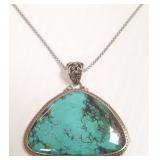 Large sterling pendant on chain set with turquoise