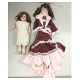 2 antique bisque head dolls - 13" & 21" long