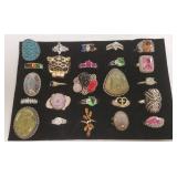 25 rings - most set with stones, some silver