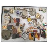 Group of collectibles including badges, pinbacks,