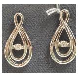 Pair 14K white gold earrings set with dancing