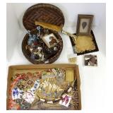 Woven basket including assorted jewelry, stone