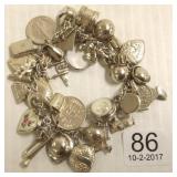 Sterling charm bracelet with many sterling