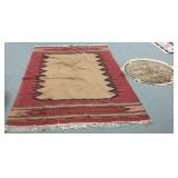 Large woven rug & a small machine made rug