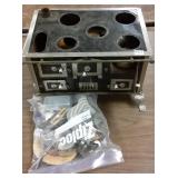 Antique metal doll stove with accessories