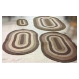 4 braided brown rugs