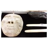 Eskimo whale bone face with Inuit carved