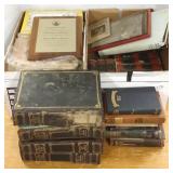 Group of books, National Geographic, JFK plaque,