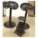 2 tractor seat stools & a heater/lamp