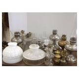 Large group of antique oil lamps, shades, etc.