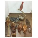Group of assorted wood carvings including birds,