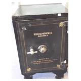 Antique iron safe with combination