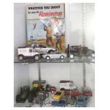 Group of assorted die cast cars & a tin sign, etc.