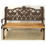 Ornate cast metal & wood bench with arms
