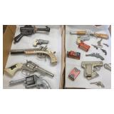 Group of vintage cap guns including scarce Buck