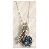 14K white gold pendant set with blue topaz &