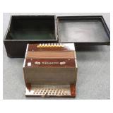 Antique Hohner accordion in case