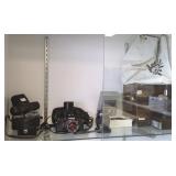 Group including Olympus camera, lenses, etc.