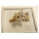14k gold star motif ring set with diamonds
